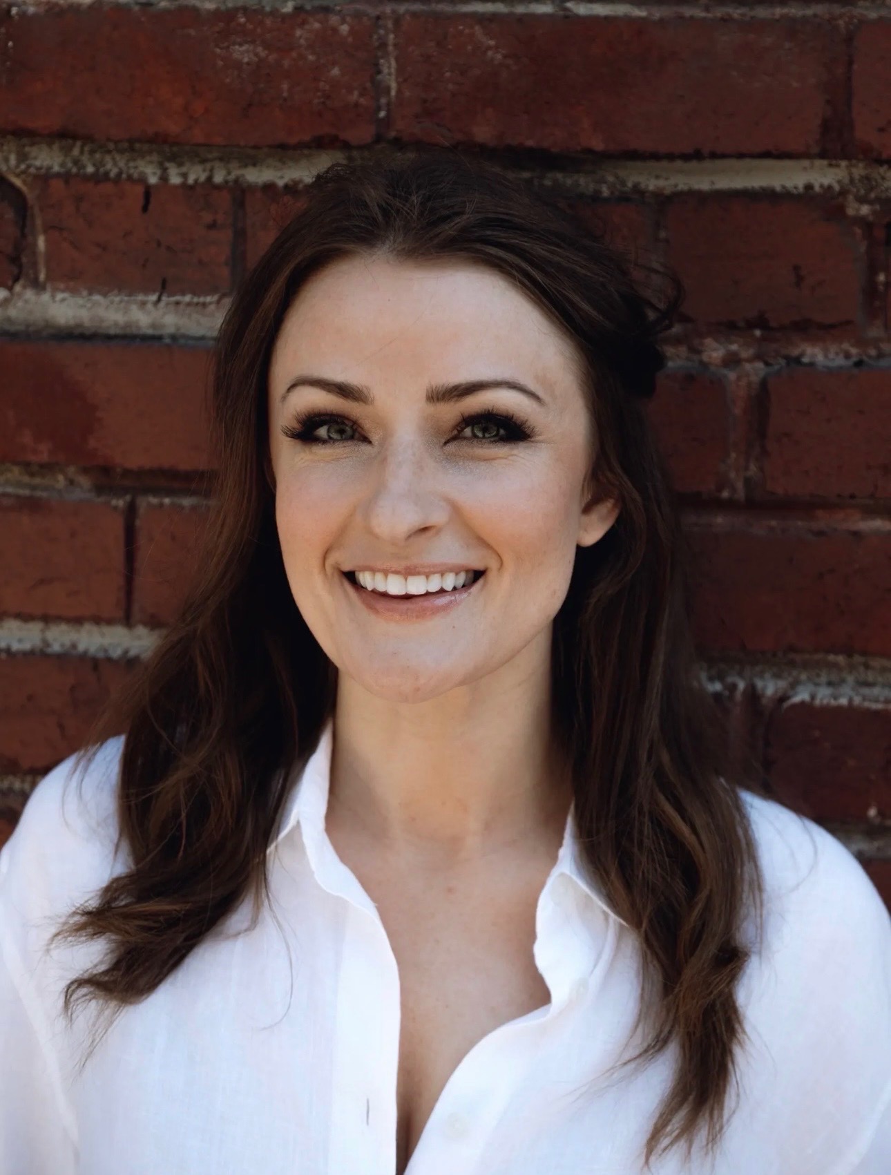 Claire Giovino, founder of Creative Money Coaching, smiling